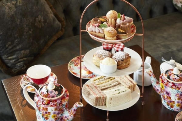 The Clermont, Charing Cross - a tray of pastries and teapots on a table