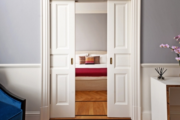 The Fifteen Keys Hotel - Hotel suite, looking through double doors from the lounge to the bedroom.