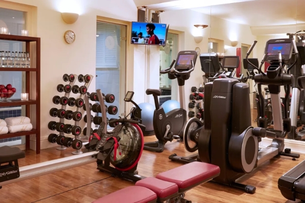 The Milestone Hotel and Residences - a room with exercise equipment