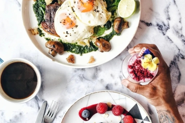 The Resident Covent Garden - a plate of food with two eggs and a drink