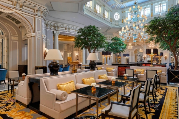 The St. Regis Rome - A large lounge area with plush seating and chandelier lighting.