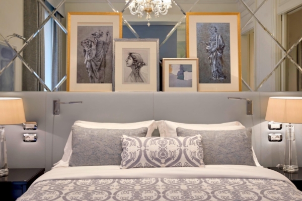 The St. Regis Rome - A powder blue luxury hotel room with soft lighting