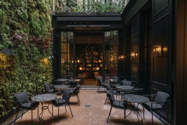 Wittmore Hotel - a patio area with tables and chairs