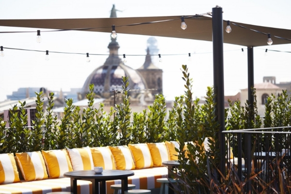 Wittmore Hotel - a patio with a table and chairs