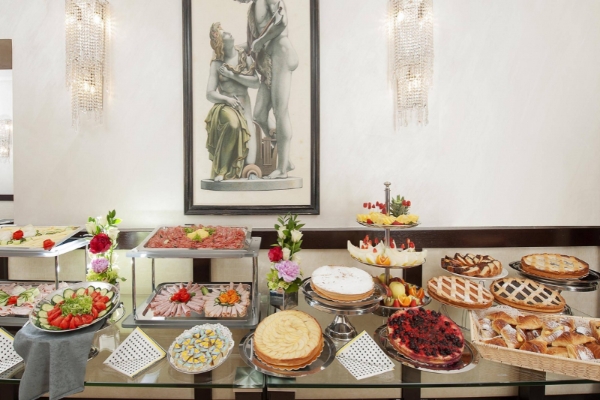 Yes Hotel Boutique Rome - Breakfast buffet with fresh pastries, fruits, cheeses and hams.